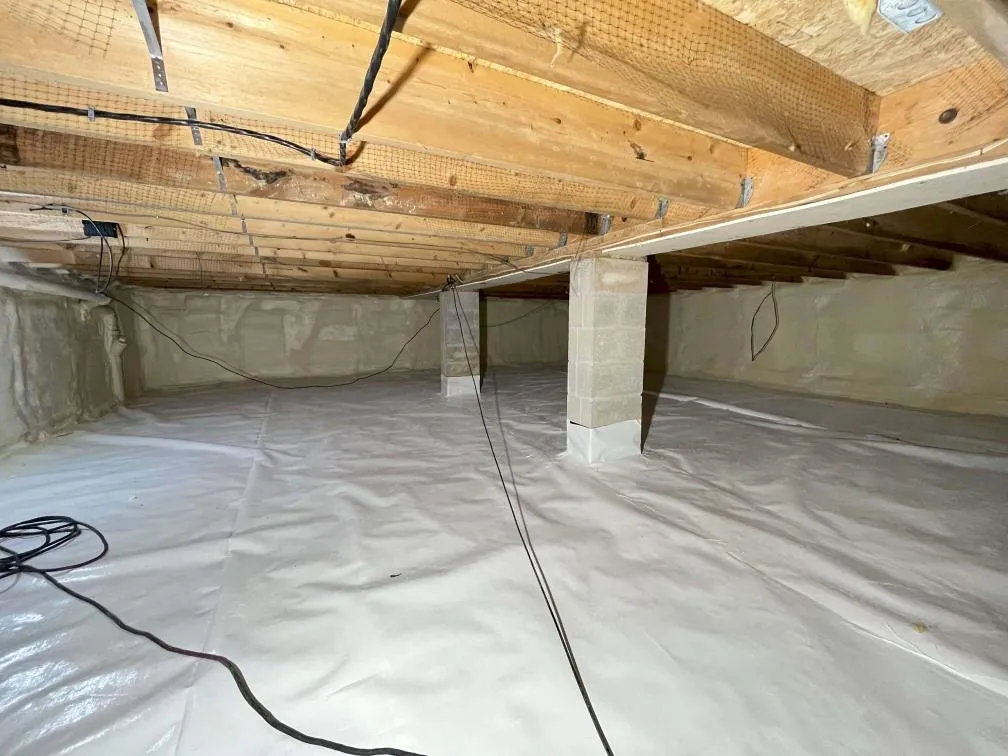 A completed crawlspace vapor barrier installation