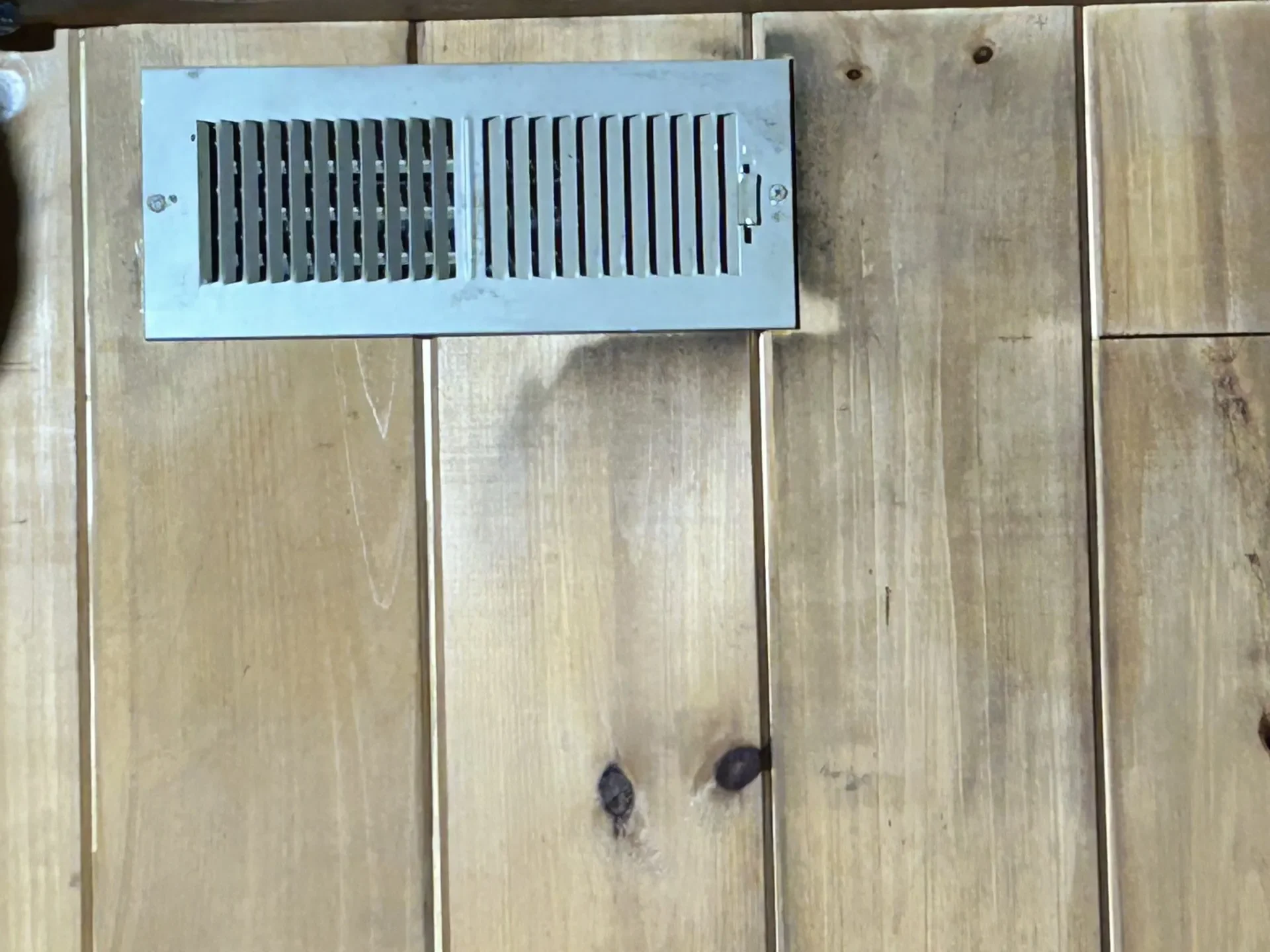 Black mold growth around an HVAC vent
